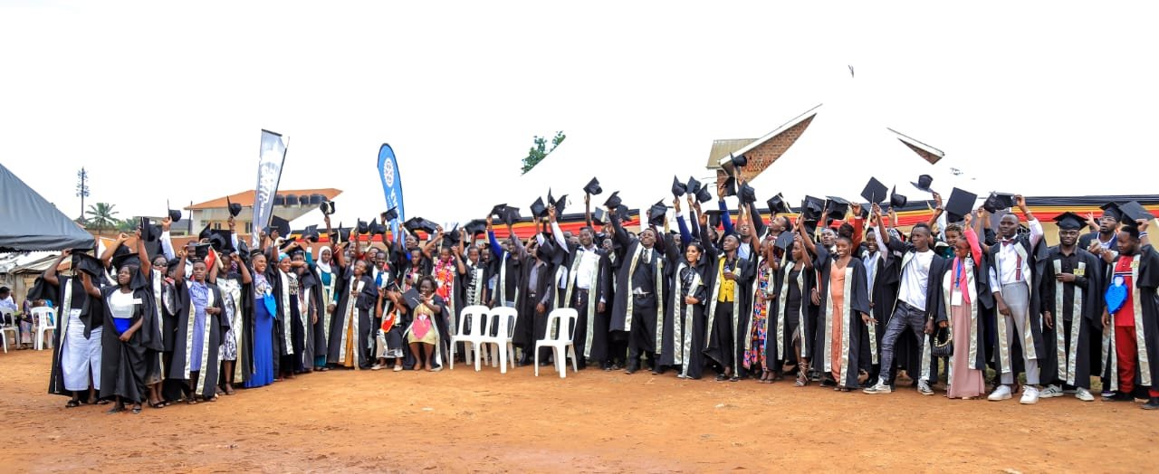 Purple Skills Klinic graduates celebrating with their caps in the air